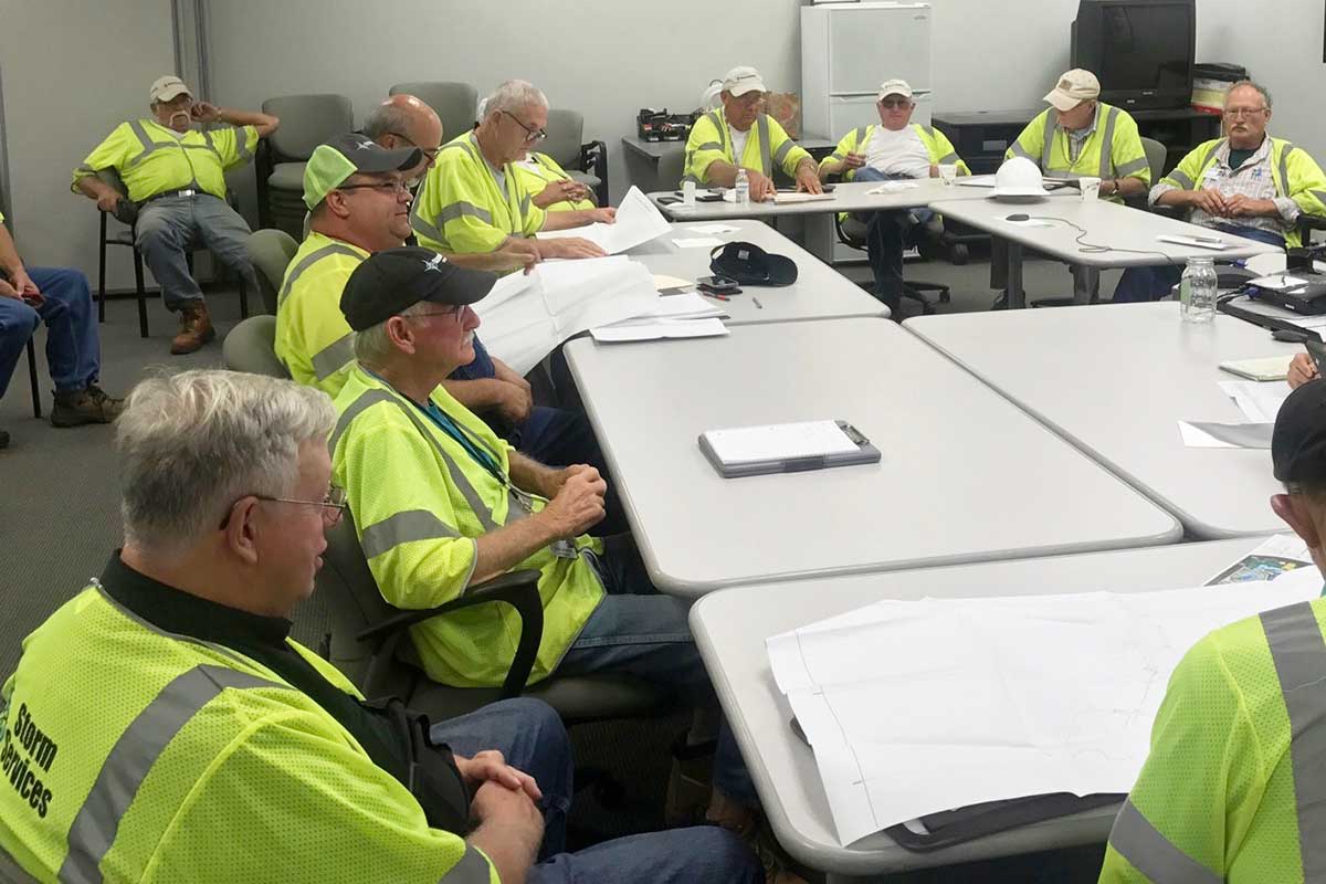 Crew coordinators meet prior to deployment.